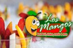 Clear cups filled with colorful sliced fruits are shown in the background. The foreground displays the "Los Mangos" logo with a winking mango and the tagline "fresh fruit, Mexican-inspired snacks, shakes & more in Little Elm.