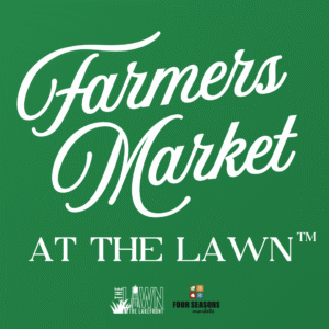 Green sign reads "Farmers Market at The Lawn" surrounded by colorful illustrations of tomatoes, eggplants, radishes, and peppers on a patterned background.