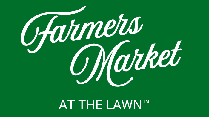 White cursive text reads "Farmers Market" above smaller white block text "AT THE LAWN™" on a green background.