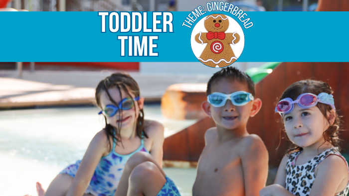 Three young children wearing swimsuits and goggles sit by the edge of a pool. A banner above reads "Toddler Time" with a gingerbread theme graphic.