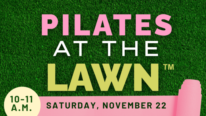 Text on green grass background reads: "PILATES AT THE LAWN™ 10–11 A.M. Saturday, November 22" with a pink yoga mat in the corner.