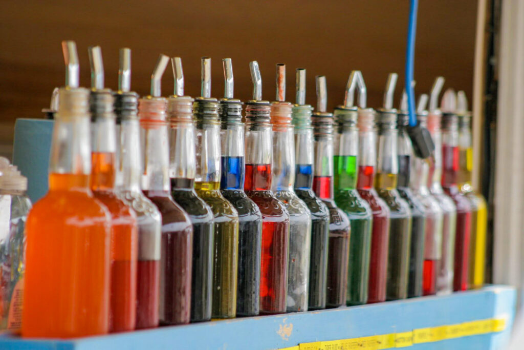 Line of snow cone syrups, multiple difference colors and flavors
