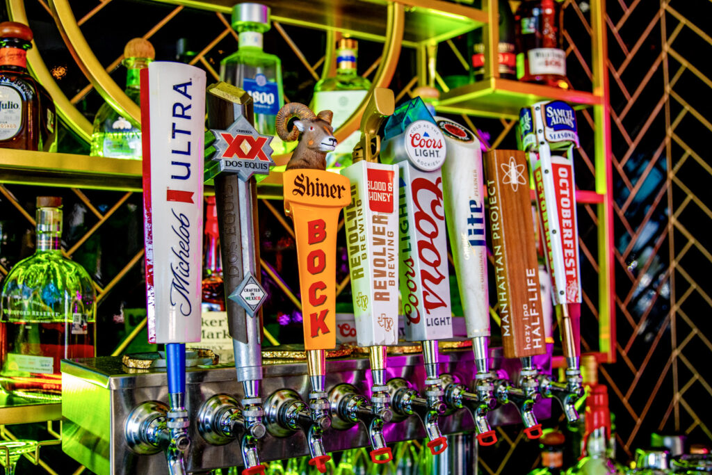 Row of beer taps with logos for Coors Light, Miller Lite, and Octoberfest